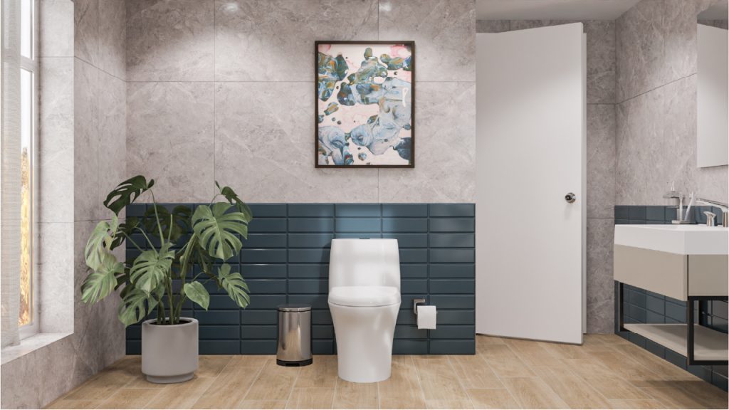 Ambiente baño Corona con revestimiento gris con acabado marmolizado y brick azul petróleo a medio muro