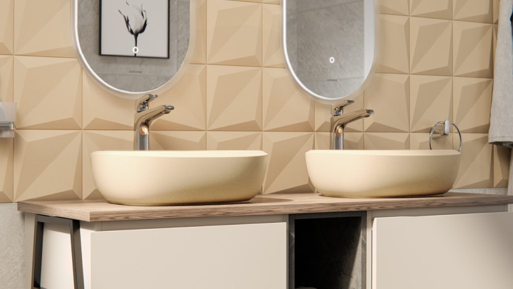Ambiente baño Corona con baldosa 3D color arena en paredes y lavamanos redondo tipo vessel Cascade