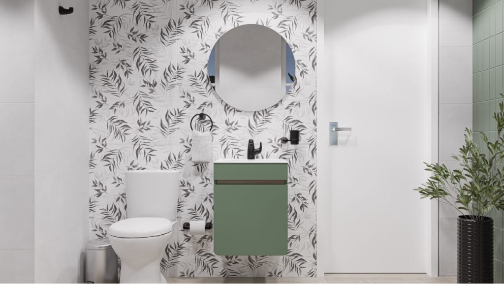 Baño Corona con baldosa en paredes con patrones de hojas negras y mueble elevado color agave.